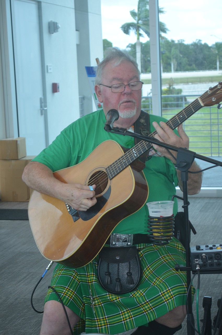 Gerry Mccruden plays in the VIP room in the finish tower at Nathan Benderson Park.