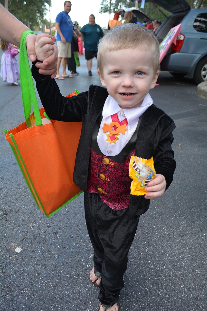 Three-year-old Christian Jones was all smiles as he collected candy.