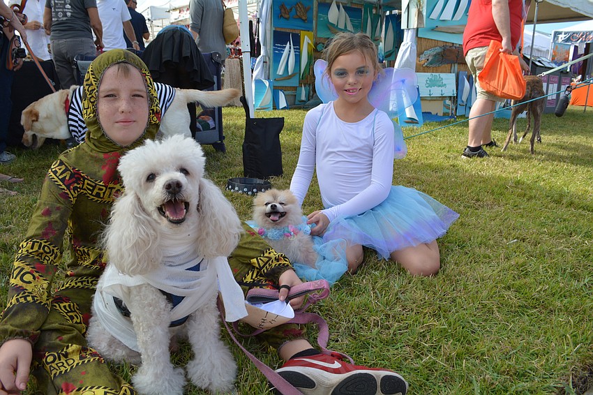 Corbin and Aubrey Hickey, of Sarasota, brought their dogs, Jacques, left, and Fred Weasley, right.