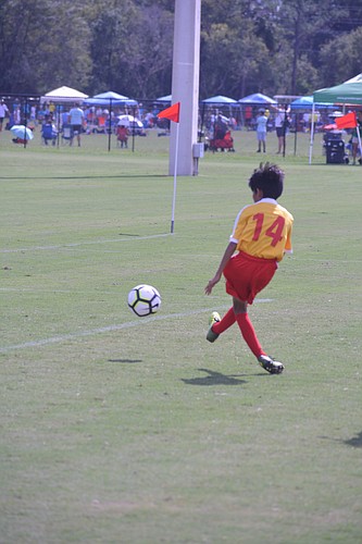 Lakewood Ranch Chargers U12 forward Gael Marez scores a goal against Cyclones Soccer Hollywood at the IVP by FIGO7 tournament.