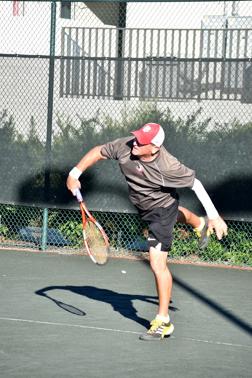 Scott Schurieman serves the ball.