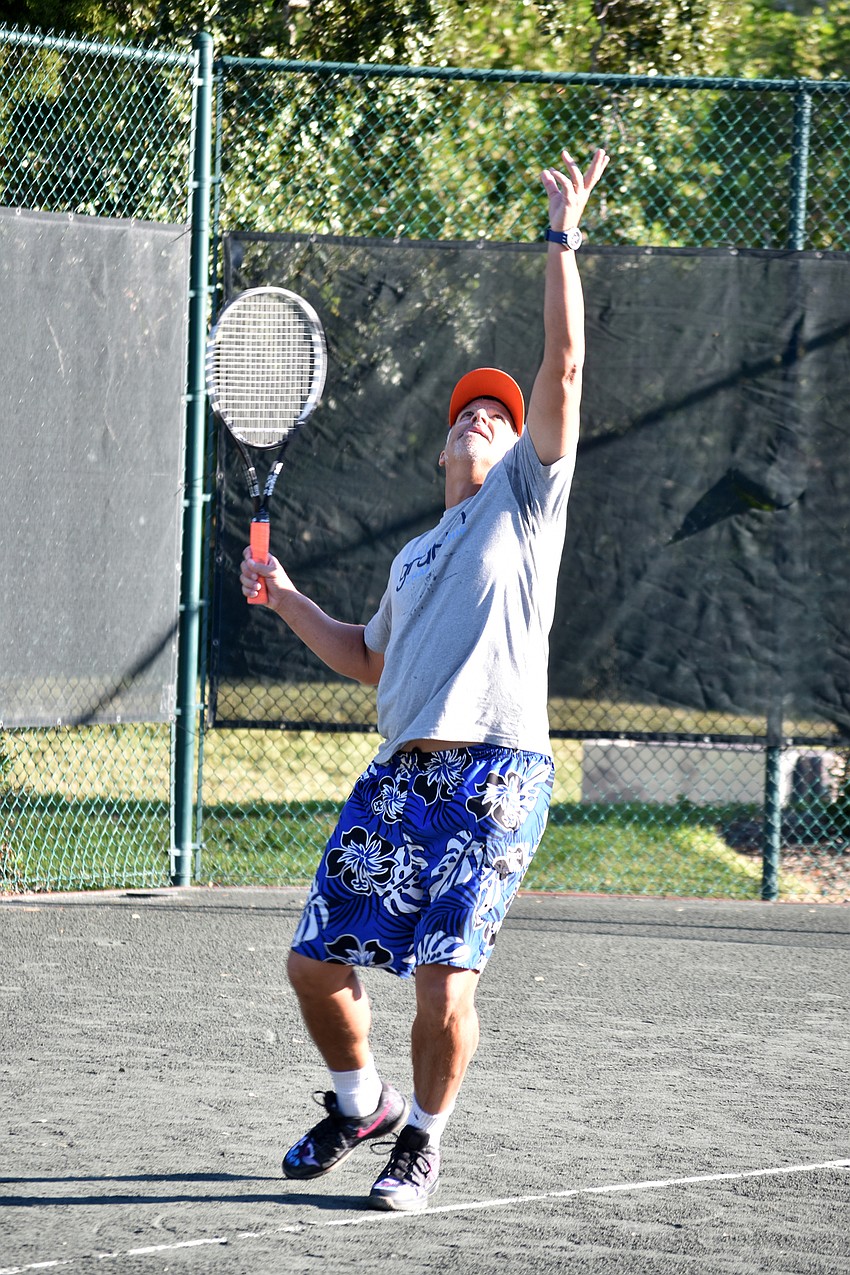 Doug Hall serves the ball.