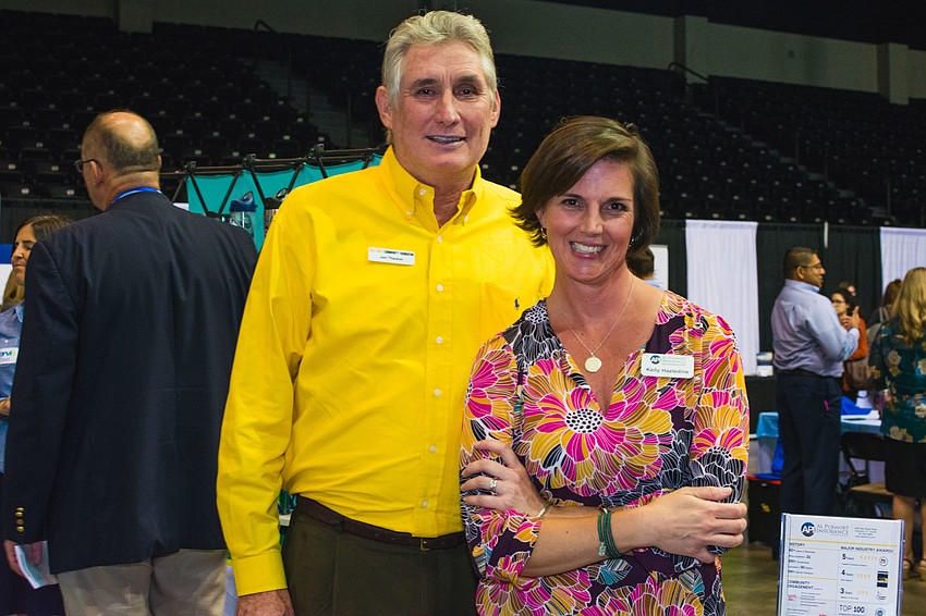 Gulf Coast Community Foundation Senior Vice President for Community Investment Jon Thaxton and  Al Purmort Insurance Client Concierge Kelly Hazledine