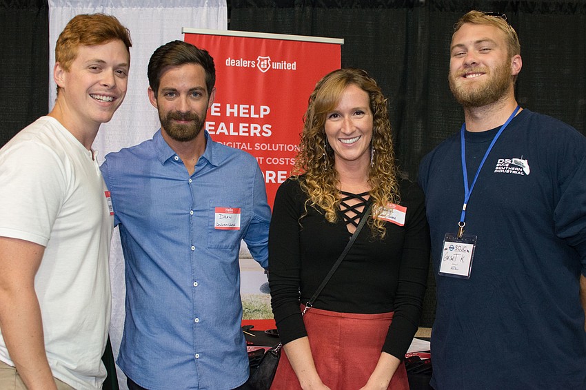 Erik Pendleton, Drew Detwiler and Katelynn Moran of Dealers United with Manatee Technical College student Grant Lee Keller