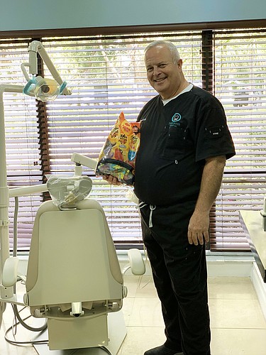 Dr. Oscar Hernandez, of Parkwood Dental, is offering to buy kids candy back and send the candy to the troops. Courtesy photo.