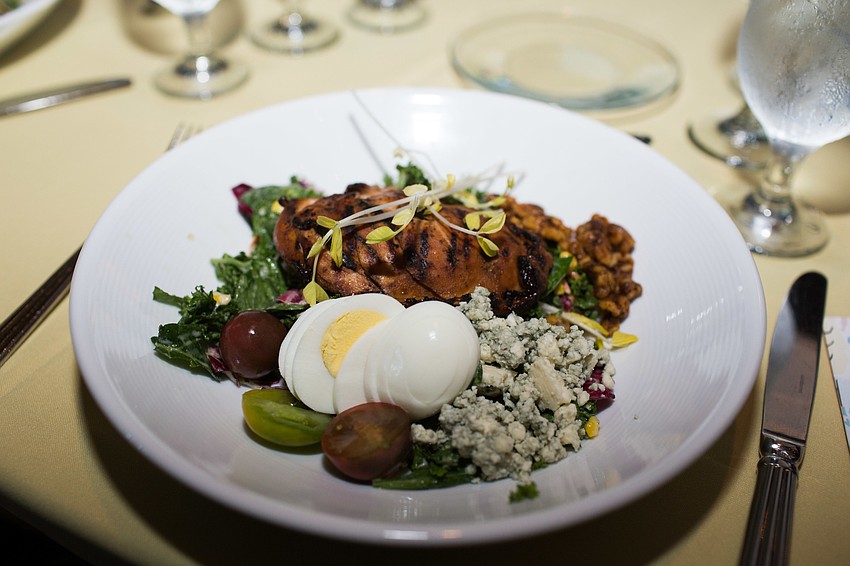 Guests were served a salad with marinated chicken for lunch.