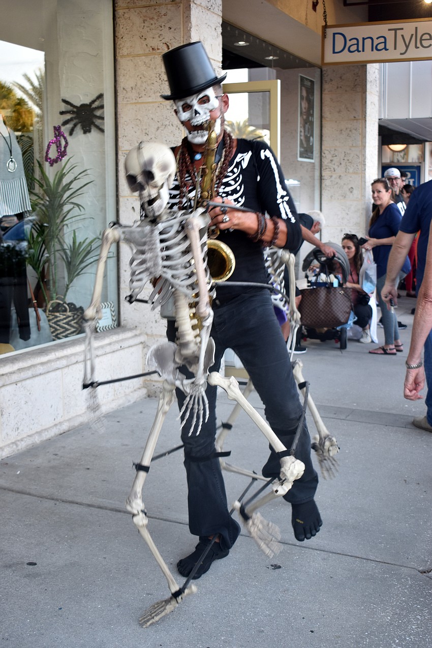 A musical skeleton parades around St. Armands during Fright Night.
