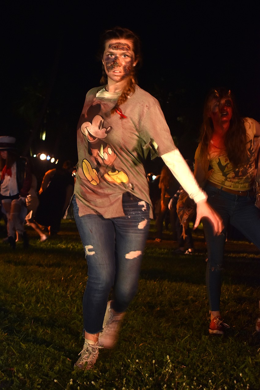 The Sarasota High School Drama Department performs “Thriller” for the crowd.