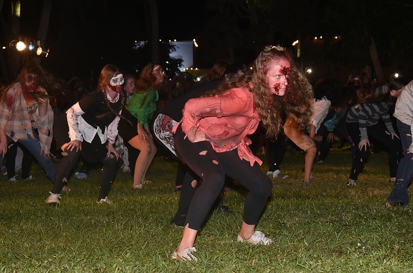 The Sarasota High School Drama Department performs “Thriller” for the crowd.