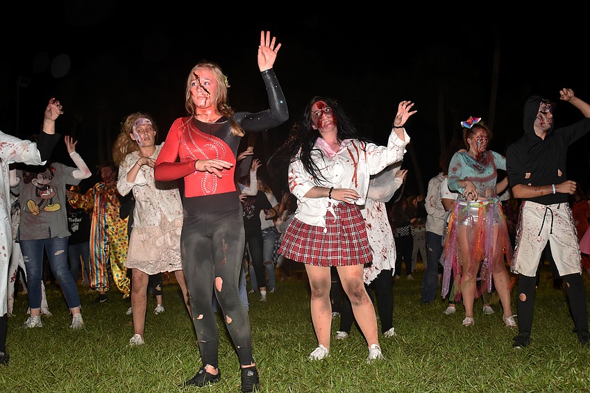 The Sarasota High School Drama Department performs “Thriller” for the crowd.