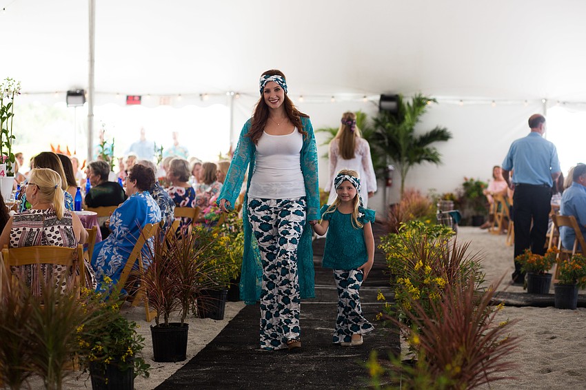 An aunt and niece duo walked the runway in Kapri Couture.