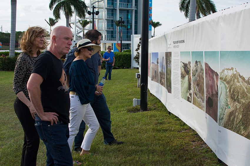 Attendees view the Fence exhibit.