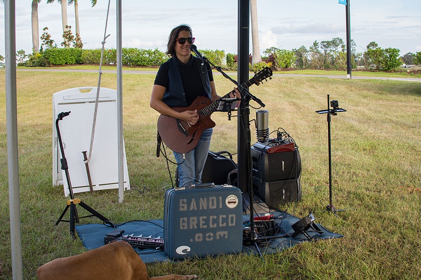 Sandi Grecco performs for attendees.