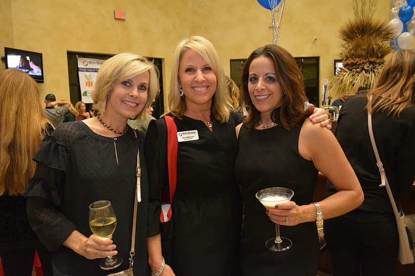Lakewood Ranch's Paula Laurvick and Gina Babcock, a foundation board member, greet Sabal Harbour's Carla Barbosa. They all are longtime supporters of the foundation.