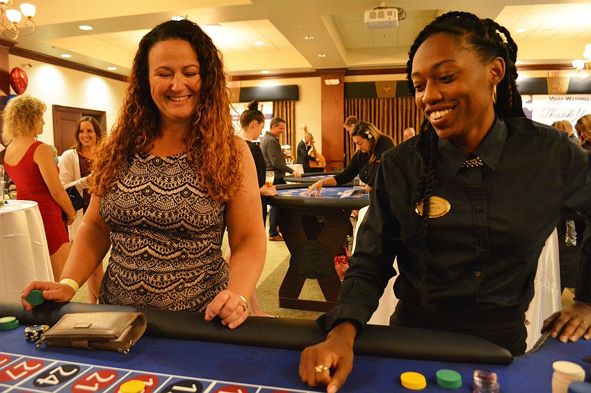 Palmetto's Ashley French wins at roulette while dealer Miranda Douglas gets ready to push chips to her.