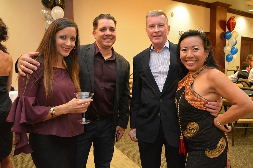 Lakewood Ranch's Cristi and Brian Martel attend the event with their friends, Alan and Debbie White, of Longboat Key.