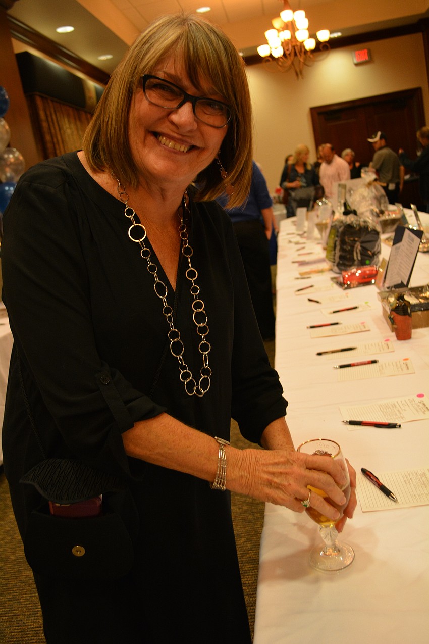 Ellenton's Nancy Porter checks out the silent auction items.