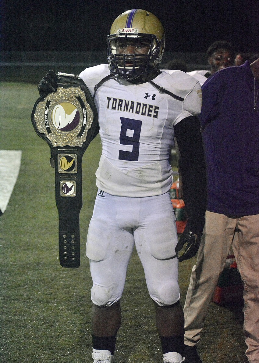 Booker senior Darrion Marshall shows off the Tornadoes' playmaker belt after returning a fumble for a touchdown.