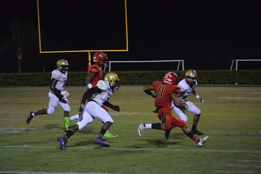 Cardinal Mooney running back Tray Hall (11) cuts through the Tornadoes defense.