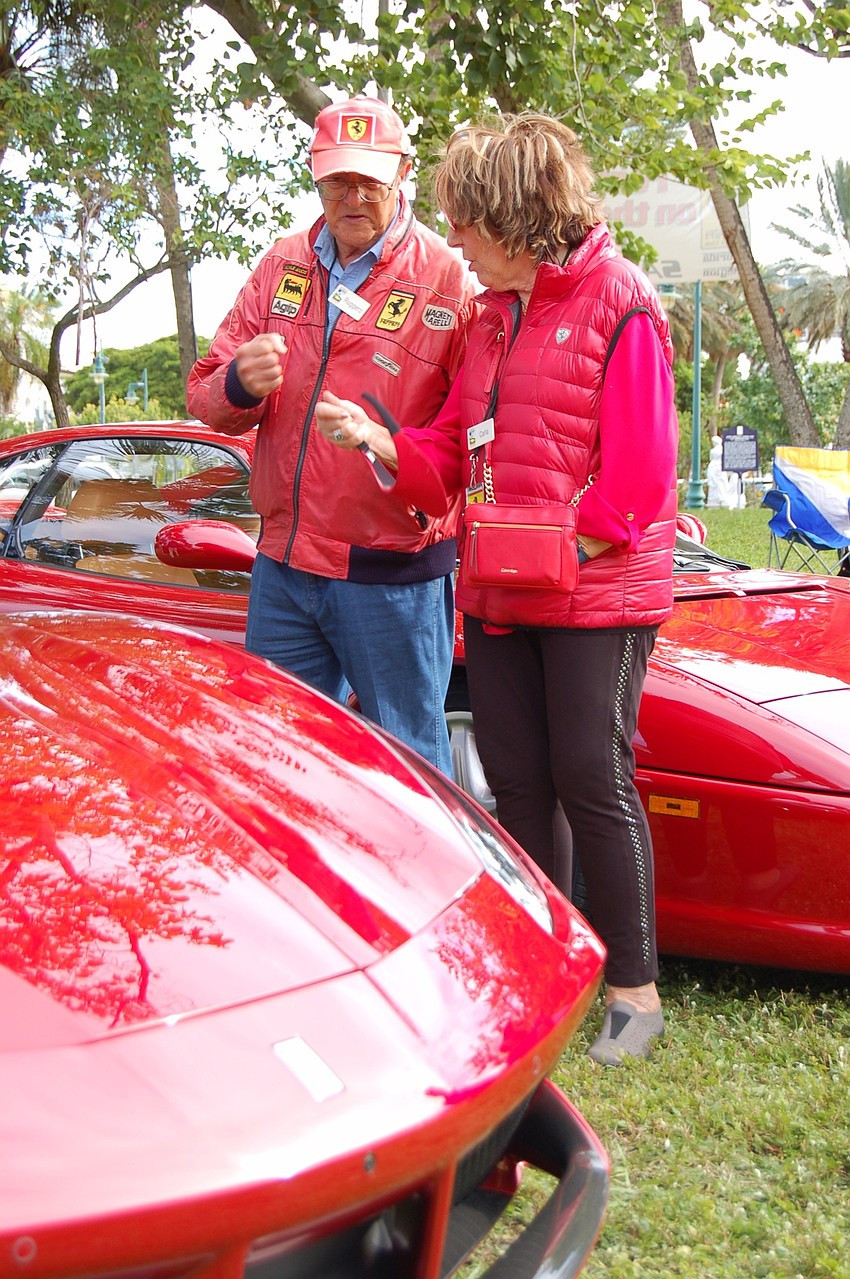 Ferrari owners Ruggero and Carla Santilli check out another Ferrari.