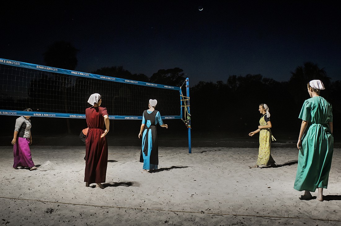 Young Amish women play a casual game of pickup volleyball on a sand court in the community of Pinecraft. Photo courtesy Dina Litovsky