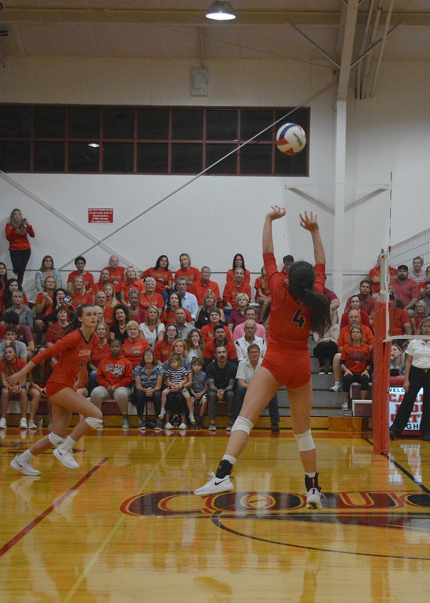 Alex Lopez sets a ball for Skye Ekes.