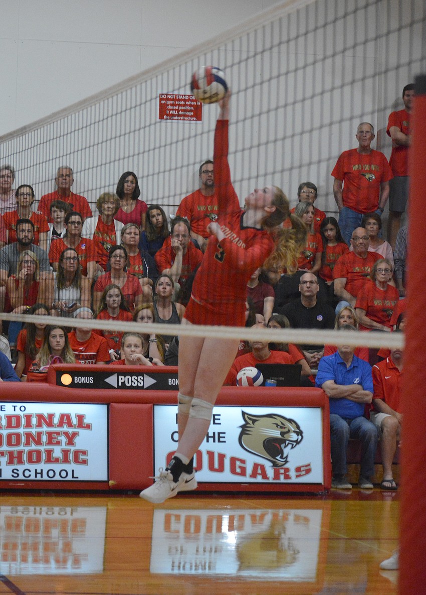 Dalton Judge fires a shot over the net.