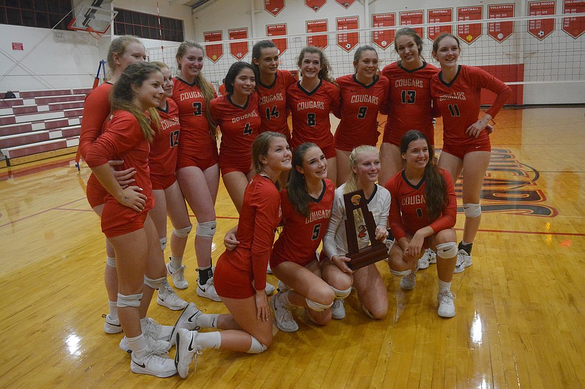 The Cougars pose with the regional trophy.