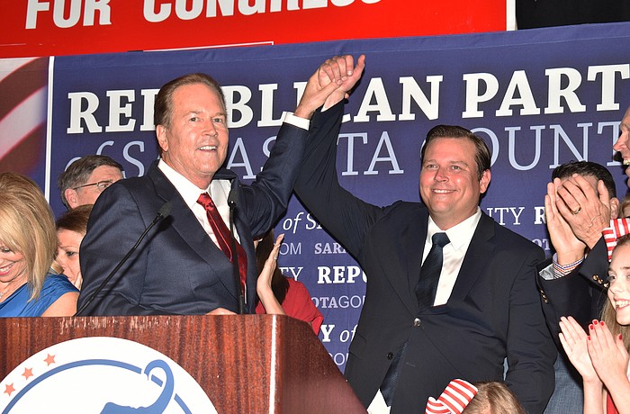 U.S. Rep. Vern Buchanan celebrates his victory Tuesday night with his son, James, who won a seat in the Florida House of Representatives.