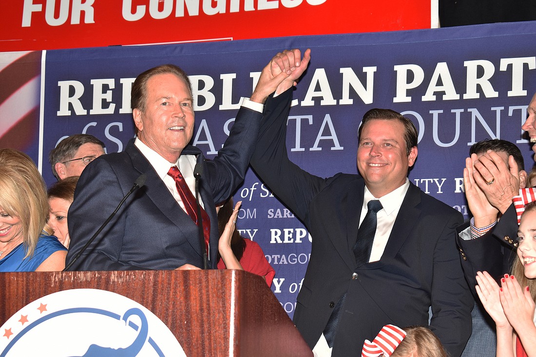 U.S. Rep. Vern Buchanan celebrates his victory Tuesday night with his son, James, who won a seat in the Florida House of Representatives.