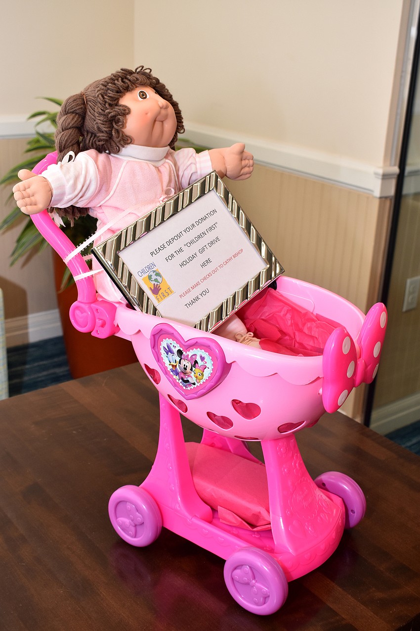 As members arrived, they could donate to the club’s holiday gift drive for Children First.