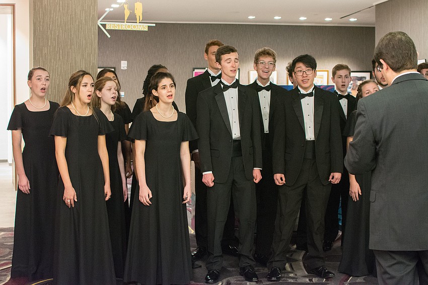 The Riverview High School Chamber Choir entertains guests.