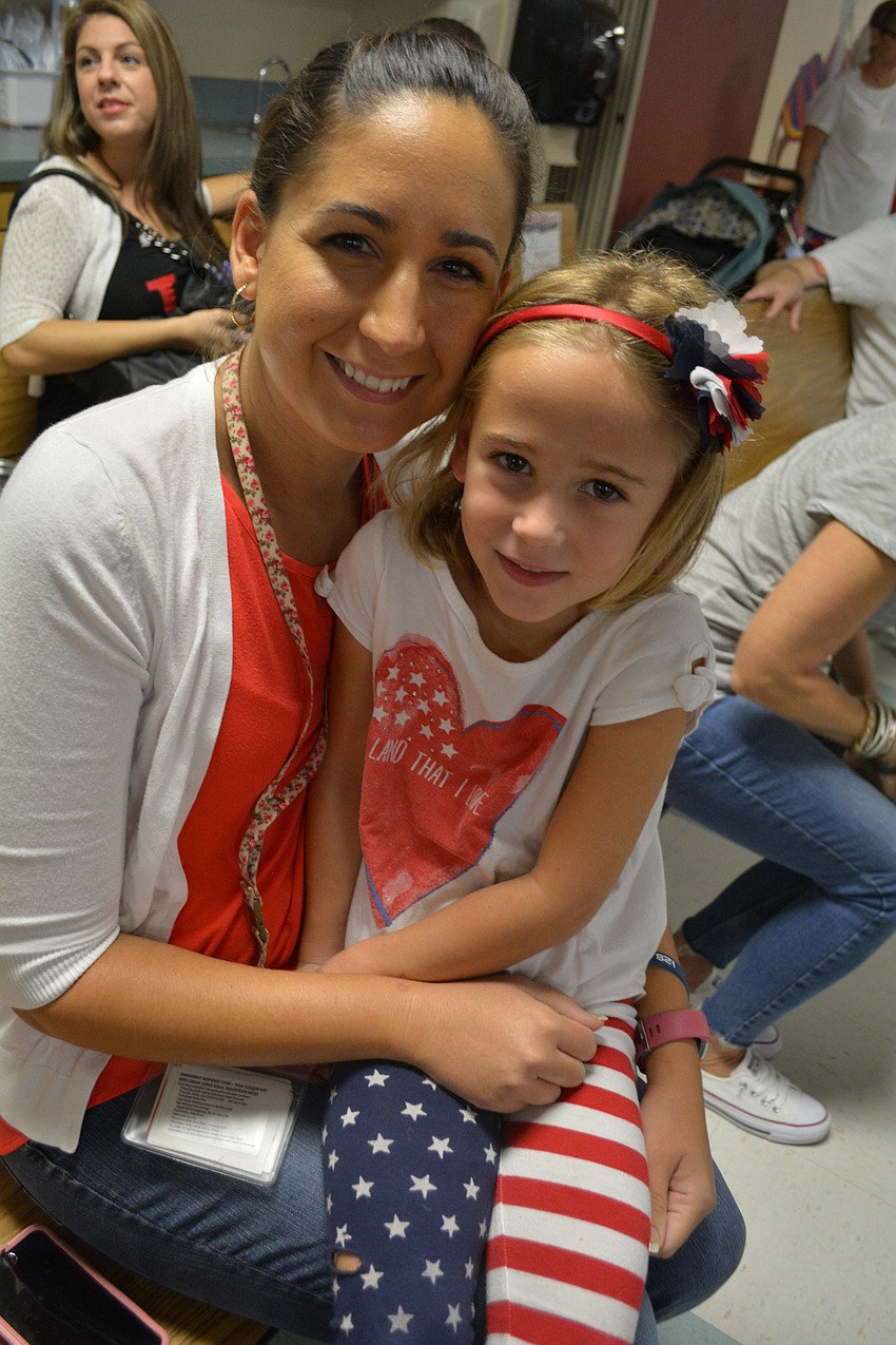 Tara Elementary School third-grade teacher Katelyn Fulghum got to snuggle with her 5-year-old daughter Ella, a kindergartner, during the show.