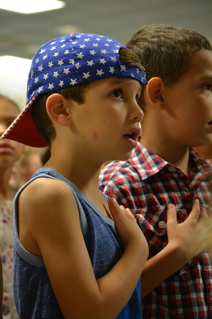 Kindergarten student Jaxon Turasz wears a patriotic hat for the celebration. He said the 