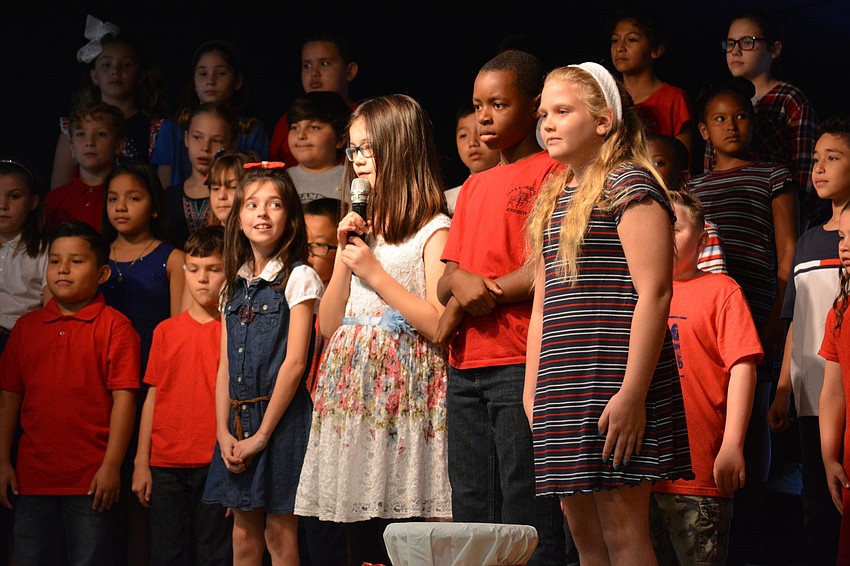 Mya Williams,  Mei Bingham, Tremaine Christmas and Ella Rodgers welcome guests and share the history of Veterans Day.