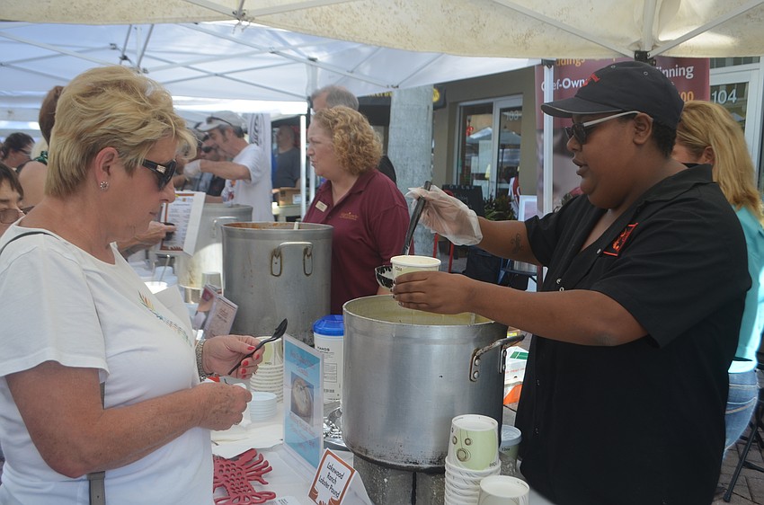 Waterlefe's Jill Pokorn says the clam chowder she is being served from Lobster Pound Lakewood Ranch by Mary Hunt is the best around.