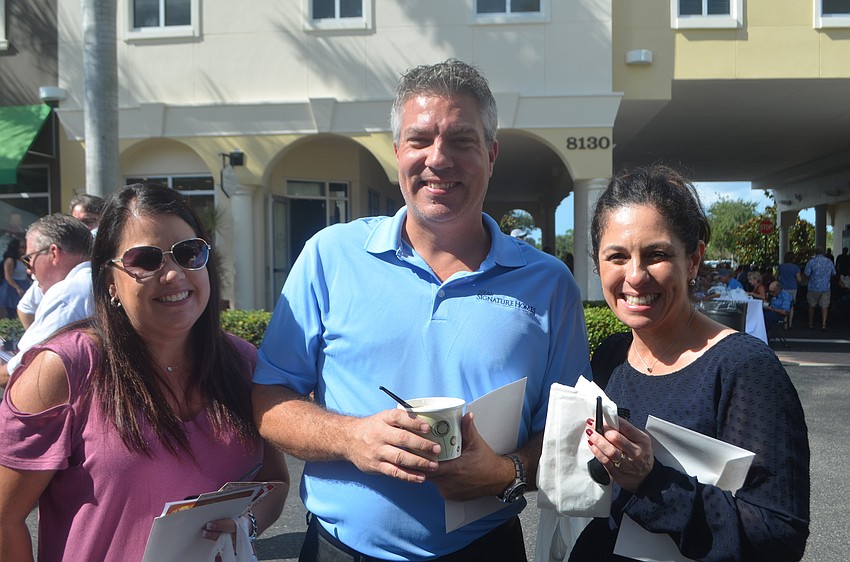 Neal Communities' Shauna Allen, John Ward and Nattaly Perez say that Empty Bowls is a cause they support, and they get to try new soups.