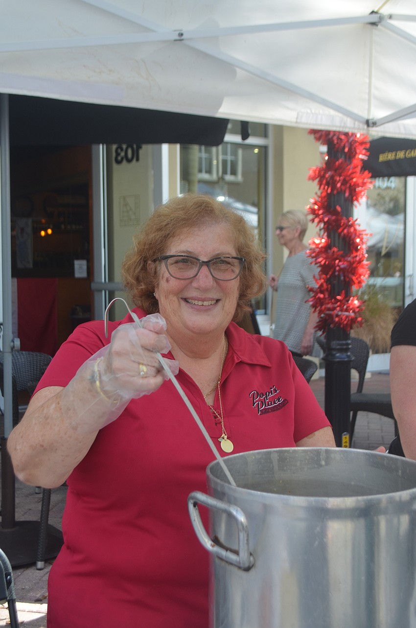 Popi Ameres serves chicken and lemon soup from her locally famous Popi's Place menu.