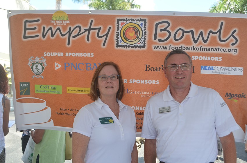 Edward Jones' Deborah Decker and Kevin Clayton volunteer at Empty Bowls, which cost $30 per person.