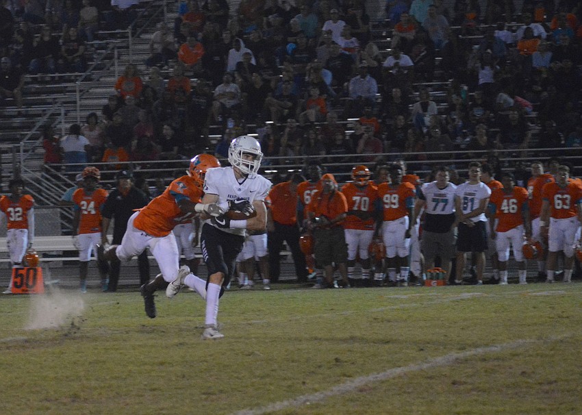 Junior wideout Robbie Goecker catches a ball off a post route for a big gain.