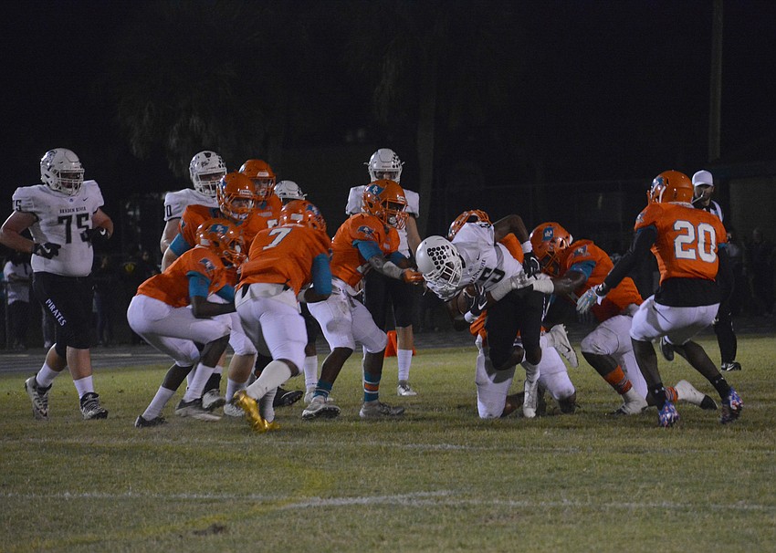 Senior wideout Clyde Townsend (5) fights through the Plant City defense for extra yardage.