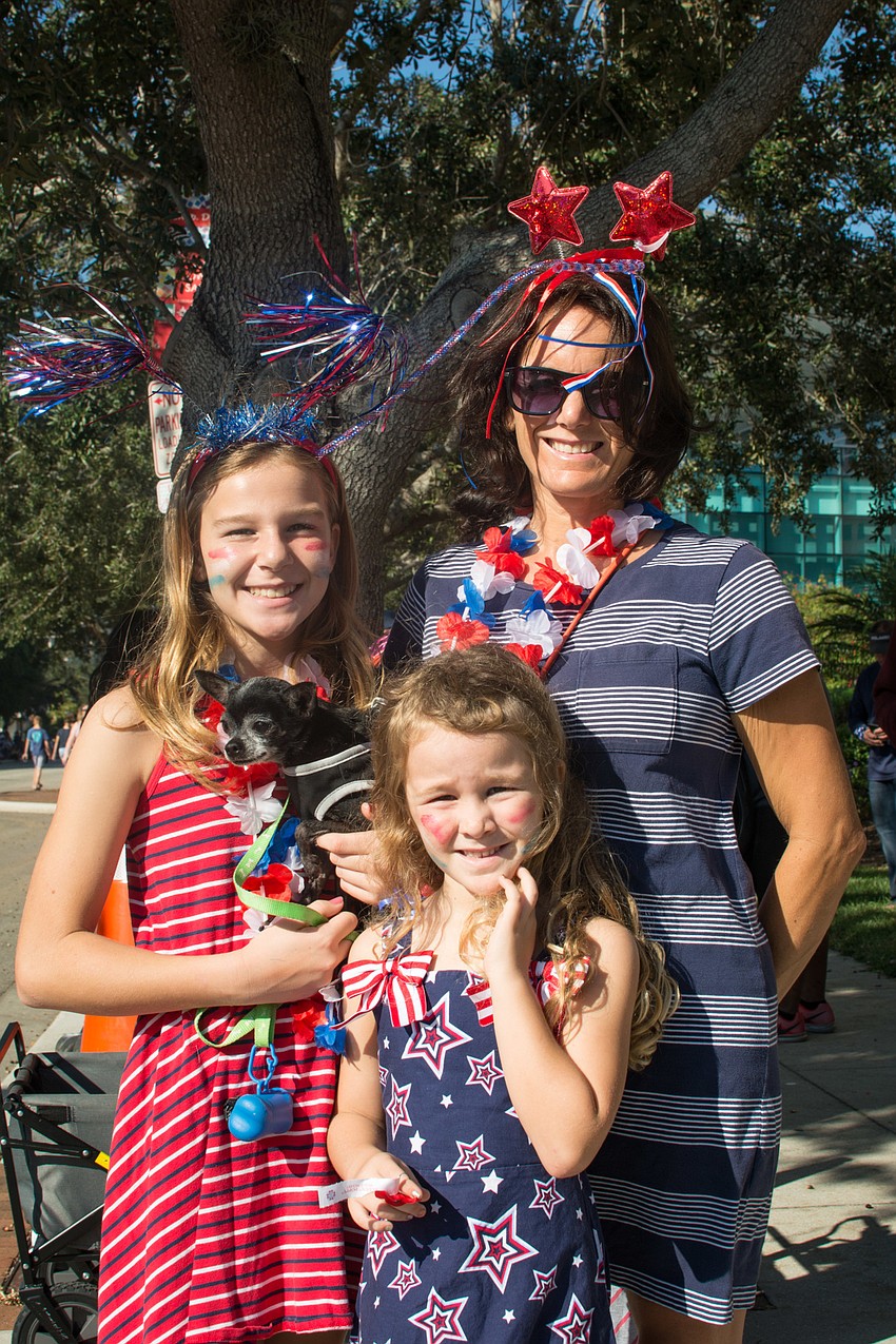 Sofia Patarina and Emily Patarini with Vicki Gee and their dog Lolita.