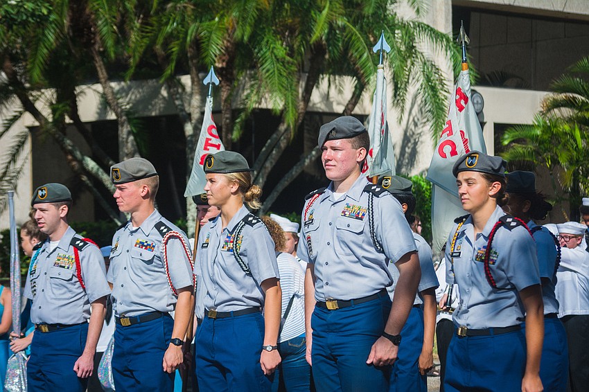 Members of Sarasota High School's ROTC get ready to march down Main Street.