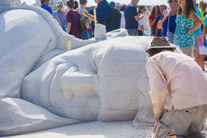 Abram Waterman from Canada works on  “Let the Revolution Begin,” which won third place in the team artist category.