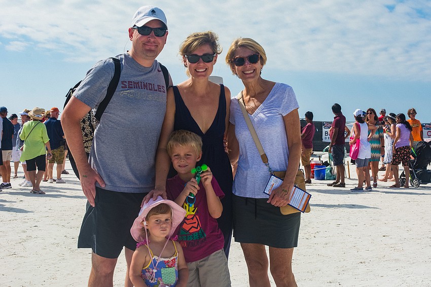 Chad McCoy, Nicole McCoy and Patricia  Courtois (back row) with Davis and Payton McCoy.