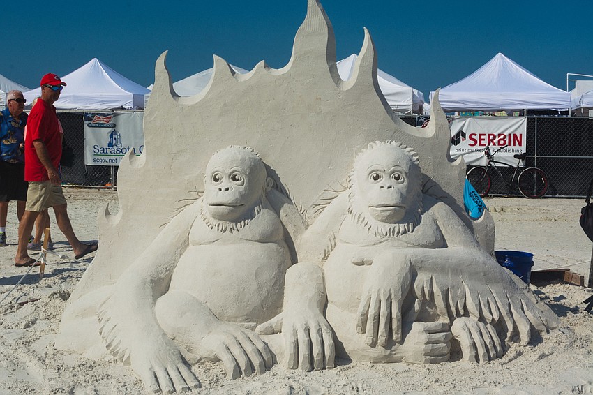 Artists from around the world, including Ronald MacDonald, of Orlando, left, and Steve Topazio, of Rhode Island, right, work during day one of The Siesta Key Crystal Classic Master Sand Sculpting Co.
