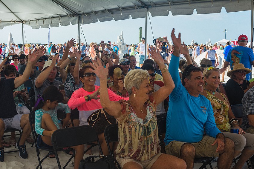 Festival attendees enjoy music from the Tropical Avenue Band.