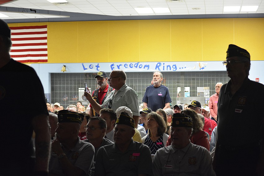 Veterans stand when music plays for their respective branch of military.