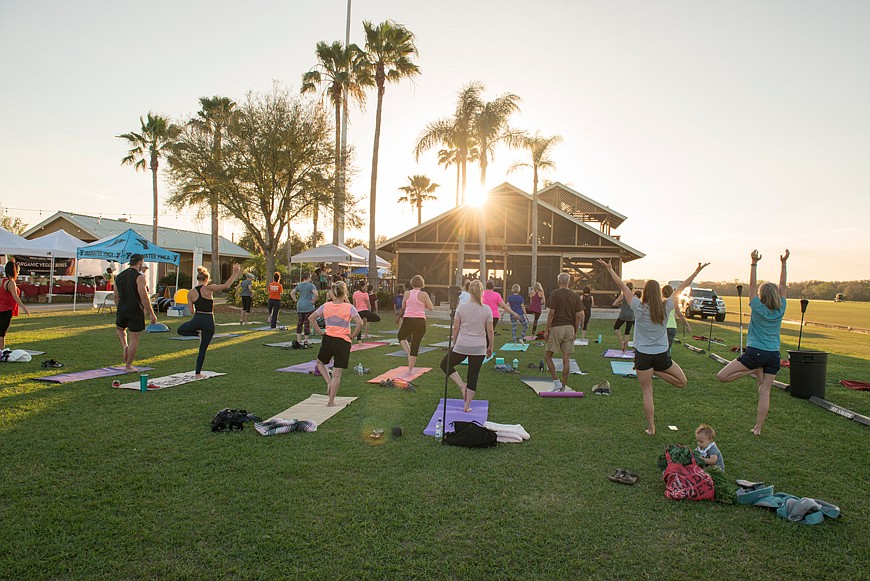 A group takes advantage of a yoga class at The Market.