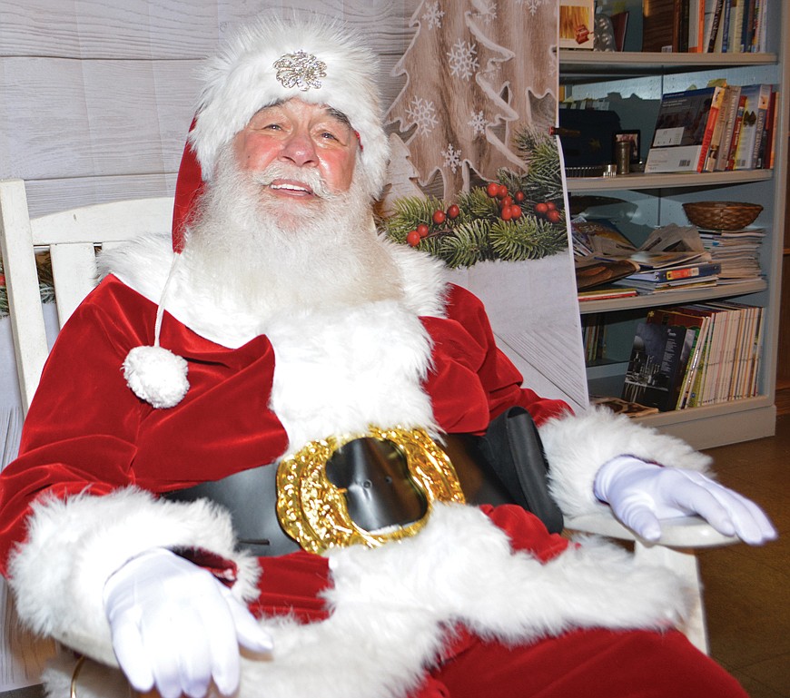 Santa takes a break from a stop in Lakewood Ranch to answer questions.